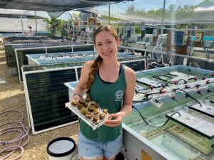 Grace McDermott displays coral samples at the Mote Marine Lab in Sarasota, Florida. Photo courtesy of Grace McDermott.