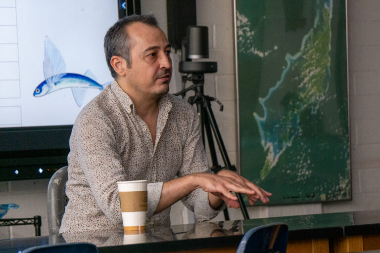 TUBRI's Dr. Bakiş in discussion with the Guam EPSCoR Biorepository team during his visit.