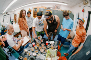 Participants of the UOG Marine Lab & NAVFAC Porifera workshop gather after a sea sponge specimen collecting session. 