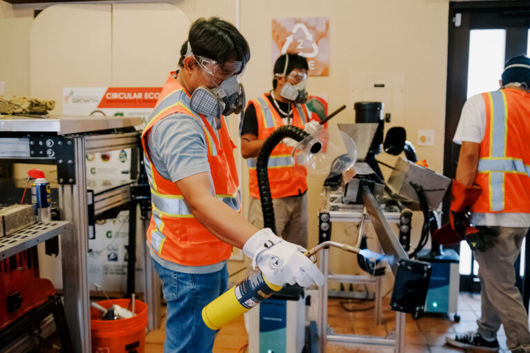 Ernesto Guades, Ph.D., an assistant professor at the University of Guam School of Engineering, heats the plastic mold attached to the extruder machine. He is conducting a research project at the Guam Green Growth (G3) Circular Economy Makerspace & Innovation Hub exploring how certain types of recyclable plastic can be prototyped into commercial-grade plastic lumber.