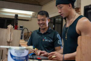 Guam Green Growth Circular Economy Makerspace and Innovation Hub technician Justin Cruz works with attendees of a laser engraver workshop at the CHamoru Village campus. The group will host another laser engraver workshop to close out October's training schedule.