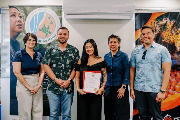 Archancel Abellera, who received an Outstanding Research Presentation award at the 2025 SACNAS Conference, receives a certificate from Sen. Vincent A.V. Borja, chair of the Legislature’s Committee on Education.