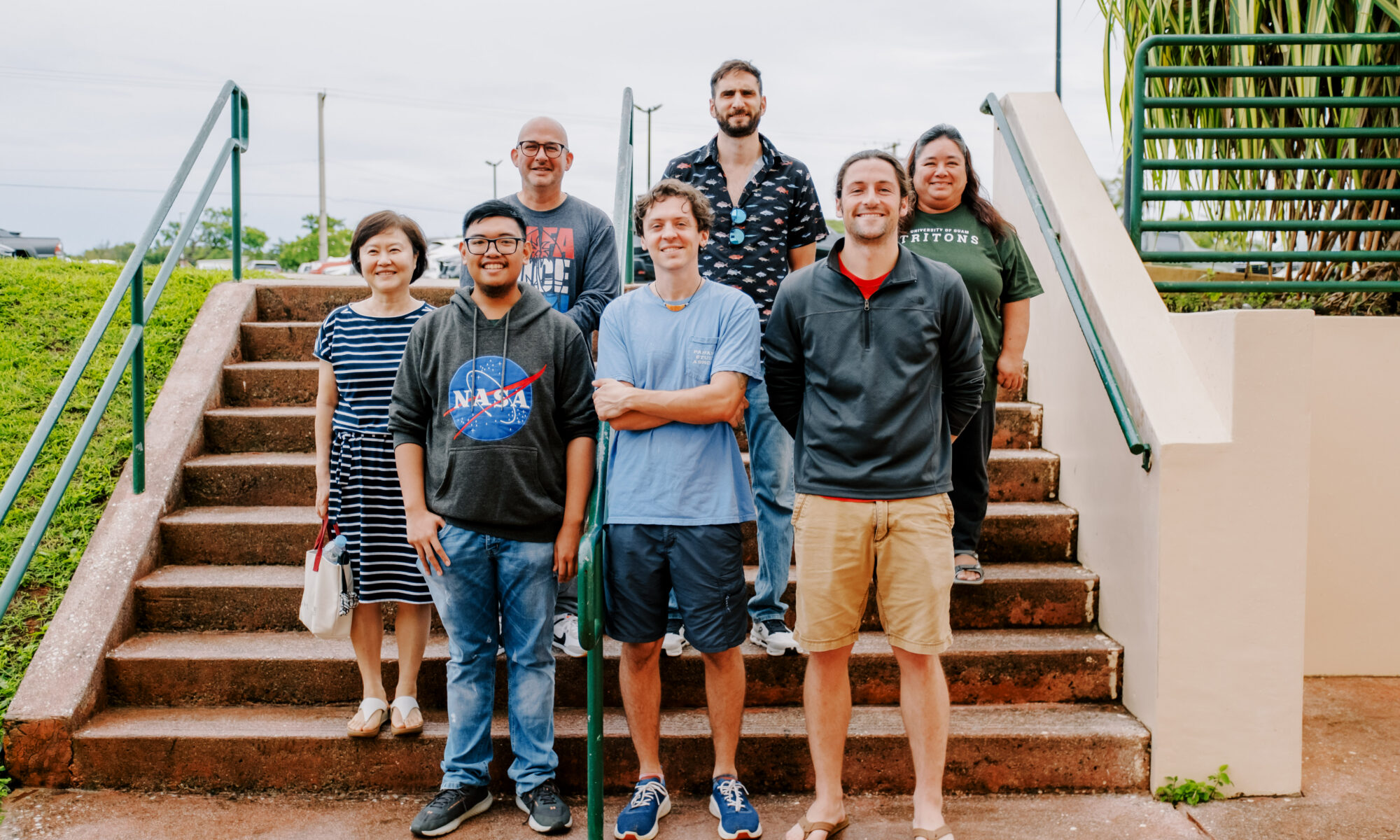 UOG NSF EPSCoR E-RISE's first graduate research assistant cohort with their faculty mentors. Front row L-R: Mark Galang, Alex Loria, and Joe Elper. Back row L-R: Dr. Hyunjin Oh, Dr. Bastian Bentlage, Dr. Michalis Mihalitsis, and Dr. Leslie Aquino. Not pictured: EPSCoR E-RISE GRA Robert Babac and faculty mentor Dr. Joo-Chul Yoon.