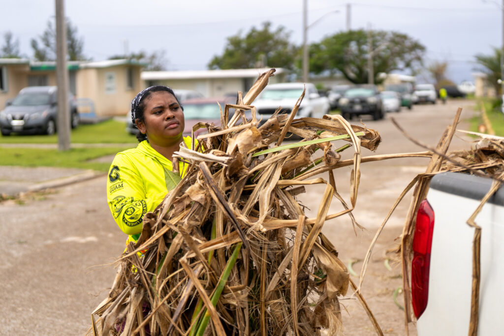 G3CC member carrying downed tree debris.
