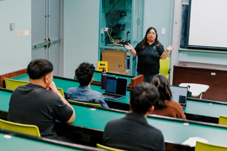 Leslie Aquino, Ph.D., a mathematics professor at the University of Guam welcomes students during the program orientation.