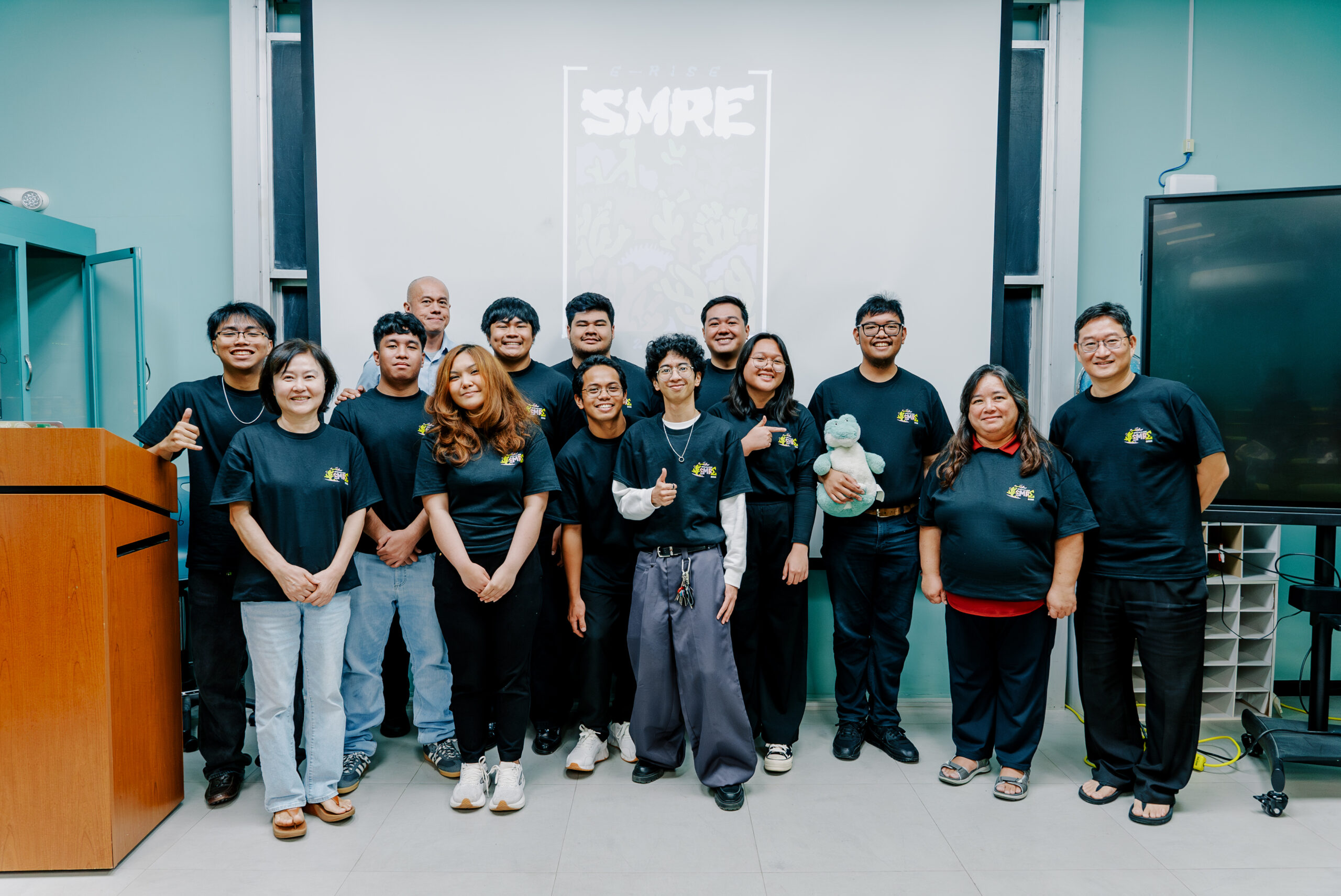 The 2026 Summer Math Research Experience (SMRE) cohort and mentors gather following the program's final presentations at the University of Guam.