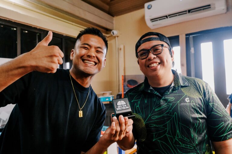 Anthony Cruz, left, and Shawn Garcia, right, holding a phone stand